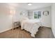 Bedroom with a comfortable bed, neutral decor, and a window with blinds at 7160 W 24Th Ave, Lakewood, CO 80214