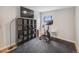 Bright bedroom featuring exercise bike and ample shelving at 7160 W 24Th Ave, Lakewood, CO 80214