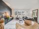 Stylish living room featuring a modern fireplace, comfortable seating, and ample natural light at 7160 W 24Th Ave, Lakewood, CO 80214