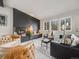 Stylish living room featuring a modern fireplace, comfortable seating, and ample natural light at 7160 W 24Th Ave, Lakewood, CO 80214