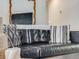 Close-up of a stylish living room with a leather couch and throw pillows at 7160 W 24Th Ave, Lakewood, CO 80214