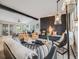 Open-concept living room featuring a modern fireplace, comfortable seating, and ample natural light at 7160 W 24Th Ave, Lakewood, CO 80214