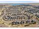 Aerial view showcasing the neighborhood with distant lakes and vast views at 26890 E Roxbury Pl, Aurora, CO 80016