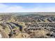 Expansive aerial shot of the community featuring a large lake and well-planned residences at 26890 E Roxbury Pl, Aurora, CO 80016