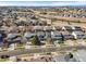 Aerial view of neighborhood with a green space in the background at 26890 E Roxbury Pl, Aurora, CO 80016