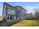 Two-story home with a deck overlooking the backyard at 26890 E Roxbury Pl, Aurora, CO 80016