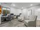 Finished basement with wood floors, dual workstations, and two comfortable gray chairs at 26890 E Roxbury Pl, Aurora, CO 80016