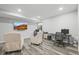 This basement has neutral walls, laminate wood floors, and two work stations at 26890 E Roxbury Pl, Aurora, CO 80016