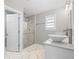 This bathroom has a glass shower and dual vessel sinks on a marble countertop at 26890 E Roxbury Pl, Aurora, CO 80016