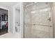 This bathroom features a stand-up shower with glass doors and a marble tile surround at 26890 E Roxbury Pl, Aurora, CO 80016