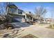 Exterior view of charming two-story home with a blue garage door at 26890 E Roxbury Pl, Aurora, CO 80016