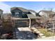Beautiful two-story home with a well-manicured lawn and inviting front porch at 26890 E Roxbury Pl, Aurora, CO 80016