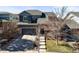 Inviting two-story home with a stone-accented facade and a well-kept front yard at 26890 E Roxbury Pl, Aurora, CO 80016