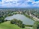 Aerial view of a lake surrounded by lush greenery and residential areas at 771 S Dale Ct, Denver, CO 80219