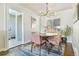 Bright dining room with modern lighting, seating for four, and hardwood floors at 771 S Dale Ct, Denver, CO 80219