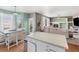 Kitchen with view into living room and fireplace at 21093 E Hampden Pl, Aurora, CO 80013