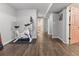 Basement featuring hardwood floors and gym with exercise equipment and good lighting at 17616 Ponderosa Ave, Parker, CO 80134