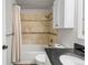Bathroom featuring a shower over bath and black granite sink top at 17616 Ponderosa Ave, Parker, CO 80134