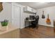 Finished basement bedroom featuring a built-in cabinet and guitars hanging on the wall at 17616 Ponderosa Ave, Parker, CO 80134