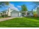 Inviting one-story home featuring a lush green lawn and an attached garage at 17616 Ponderosa Ave, Parker, CO 80134