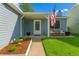 Cozy front porch with rocking chairs and an American flag display at 17616 Ponderosa Ave, Parker, CO 80134