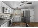 Well-lit kitchen with stainless steel appliances, white cabinetry, and a view from the window at 17616 Ponderosa Ave, Parker, CO 80134