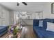 Open-concept living room with hardwood floors and a view to the kitchen at 17616 Ponderosa Ave, Parker, CO 80134