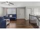 Cozy living room showcasing hardwood floors and a staircase at 17616 Ponderosa Ave, Parker, CO 80134