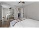 Spacious bedroom featuring hardwood floors and a mirrored closet at 17616 Ponderosa Ave, Parker, CO 80134