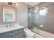 Stylish bathroom boasts double sinks, a tub/shower, and sophisticated fixtures at 7400 S Genoa Cir, Centennial, CO 80016