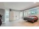 Neutral bedroom with a double door closet and a window with a view of the backyard at 7400 S Genoa Cir, Centennial, CO 80016