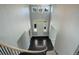 Elegant two-story foyer with dark tile, staircase and bright, natural light streaming in through the front door and windows at 7400 S Genoa Cir, Centennial, CO 80016