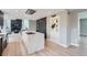 Spacious open kitchen with large marble island, modern appliances, and hardwood floors at 7400 S Genoa Cir, Centennial, CO 80016
