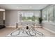 Cozy living room with neutral decor, hardwood floors, and a large window with scenic views at 7400 S Genoa Cir, Centennial, CO 80016