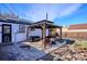 Backyard featuring a covered patio with seating and yard area at 1770 S Yuma St, Denver, CO 80223