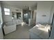 Luxurious bathroom featuring double sinks, a soaking tub, and a glass-enclosed shower for a spa-like experience at 3340 Backdrop Ct, Castle Rock, CO 80108