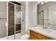 Bathroom features a glass shower, modern vanity, and neutral tile at 3340 Backdrop Ct, Castle Rock, CO 80108