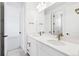 Bright bathroom with double vanity, quartz countertop, and modern fixtures at 3340 Backdrop Ct, Castle Rock, CO 80108