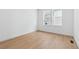 Bright bedroom featuring hardwood floors and a large window at 3340 Backdrop Ct, Castle Rock, CO 80108