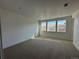 Bright, spacious bedroom with ample natural light from the large windows and plush carpeting at 3340 Backdrop Ct, Castle Rock, CO 80108