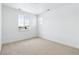 Well-lit bedroom with plush carpet, neutral walls, and two bright windows at 3340 Backdrop Ct, Castle Rock, CO 80108