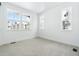 Bright bedroom with three windows and neutral carpet at 3340 Backdrop Ct, Castle Rock, CO 80108