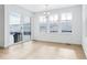 Bright dining area with large windows offers views of the snowy landscape at 3340 Backdrop Ct, Castle Rock, CO 80108