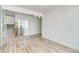 Modern dining room with wood flooring, a glass wall, and a contemporary chandelier at 3340 Backdrop Ct, Castle Rock, CO 80108