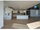 Modern open concept kitchen with stainless steel appliances, quartz countertops, and a large center island at 3340 Backdrop Ct, Castle Rock, CO 80108