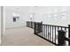 Upstairs loft area with dark railing overlooking the downstairs living area at 3340 Backdrop Ct, Castle Rock, CO 80108