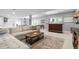 Spacious finished basement featuring a bar, pool table, and comfortable seating at 920 Shady Oak Ln, Castle Pines, CO 80108