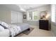 Cozy bedroom with natural light, large closet, neutral walls, and carpet flooring at 920 Shady Oak Ln, Castle Pines, CO 80108