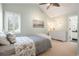 Bedroom with sloped ceiling, neutral walls, carpet flooring, and dresser at 920 Shady Oak Ln, Castle Pines, CO 80108
