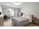 Comfortable bedroom with carpet, ceiling fan, and natural light from the window with shutters at 920 Shady Oak Ln, Castle Pines, CO 80108